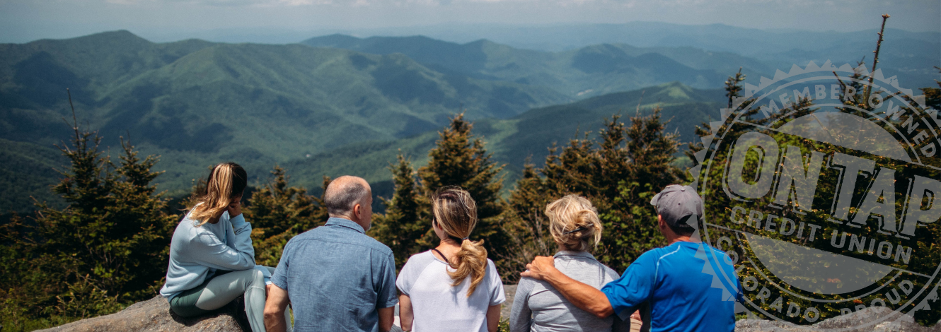 older couple biking in wilderness